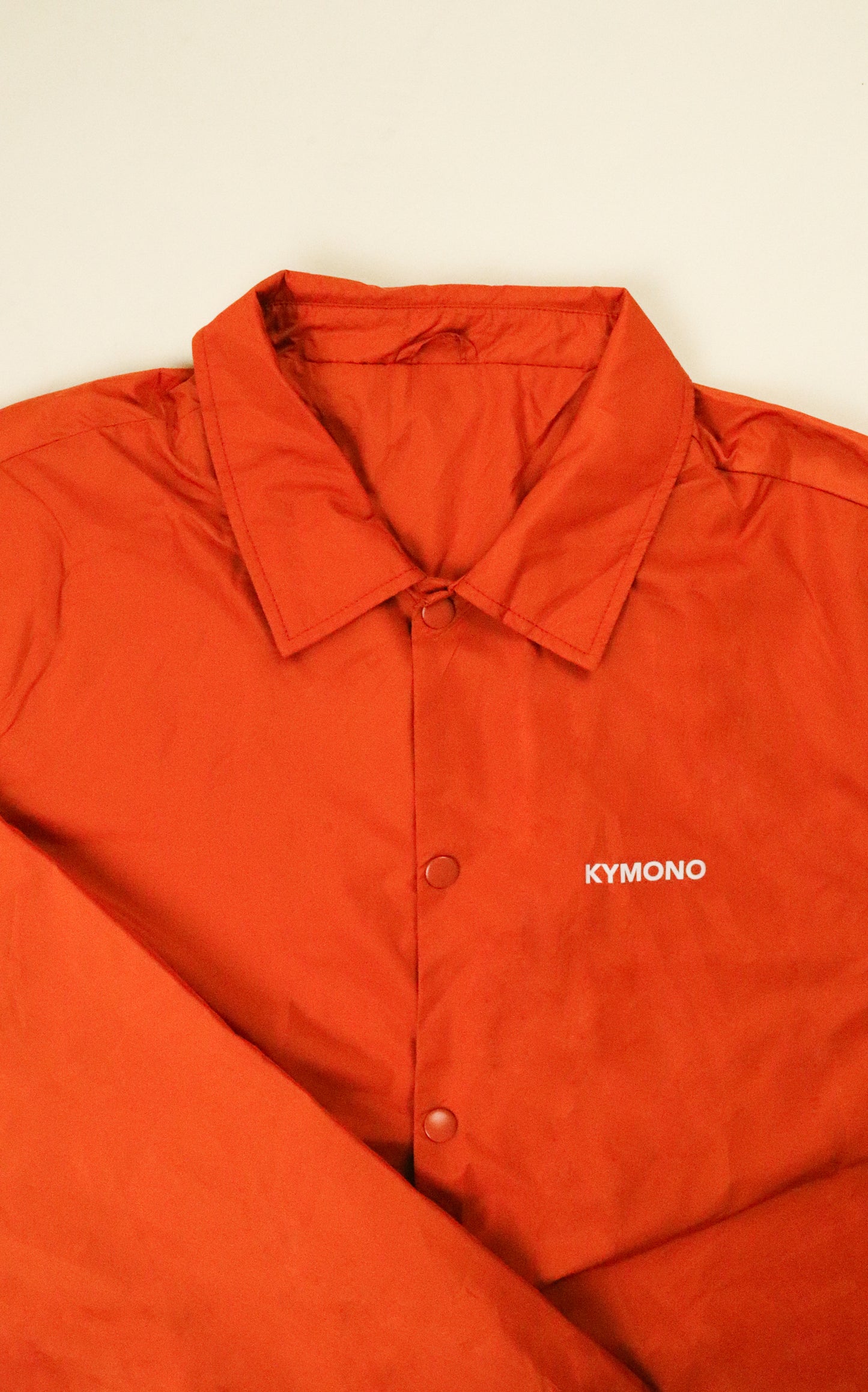 VESTE ORANGE COACH